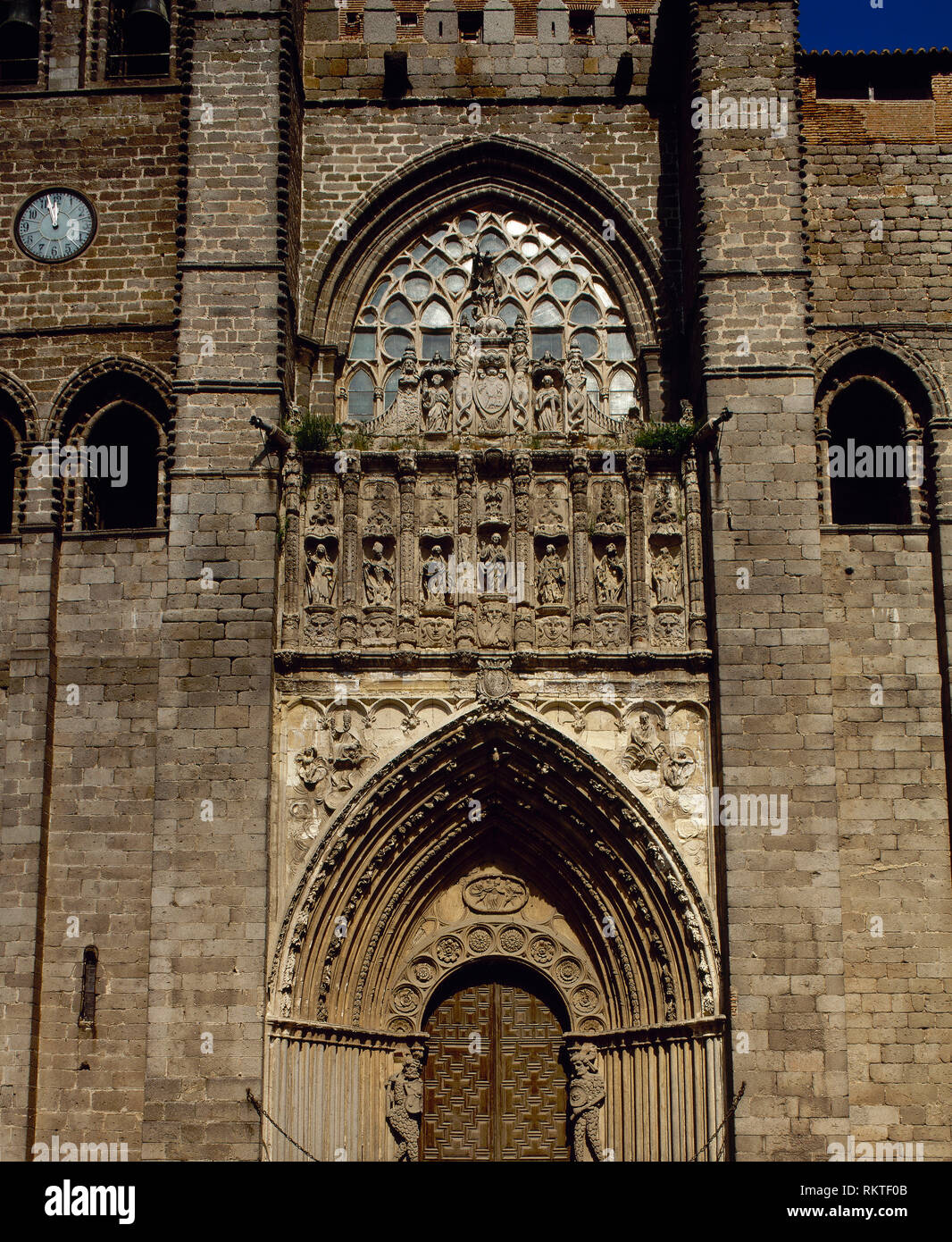 Spain, Castile and Leon, Avila. Cathedral of St. Salvador. Catholic church. It was started in the 12th century in Romanesque style and concluded in the 14th century in Gothic style. Western facade, doorway. Stock Photo