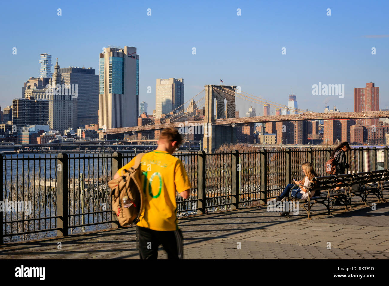 New York City, New York, United States of America - People on the promenade Brooklyn Heights, panoramic view in direction Manhattan skyline and Brookl Stock Photo