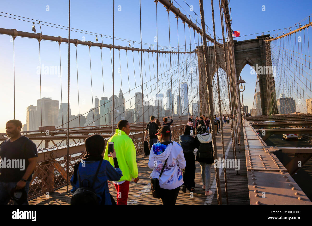 New York City, New York, United States of America - People on the Brooklyn Bridge, view of the Manhattan skyline with Freedom Tower, USA. New York Cit Stock Photo