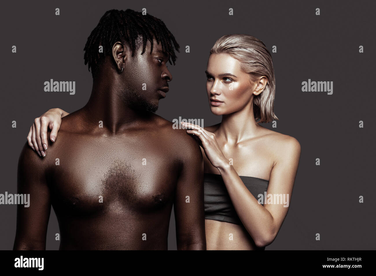 African-American model with dreadlocks looking at his colleague Stock Photo  - Alamy