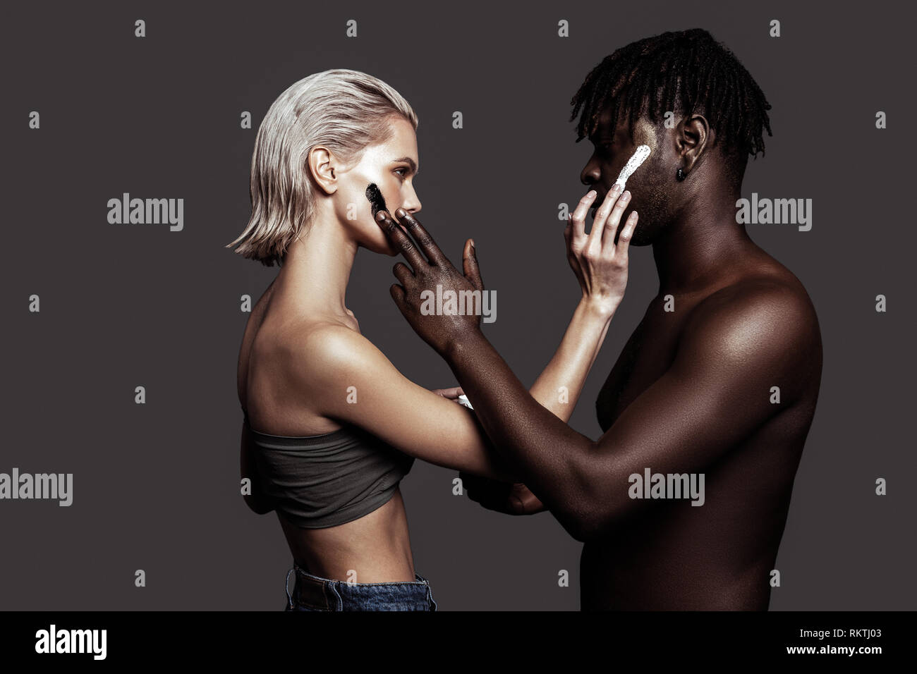 Two models with different skin colors promoting cosmetics Stock Photo