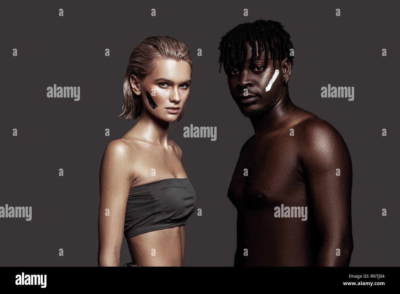 Slim appealing models with different skin color posing together Stock Photo  - Alamy