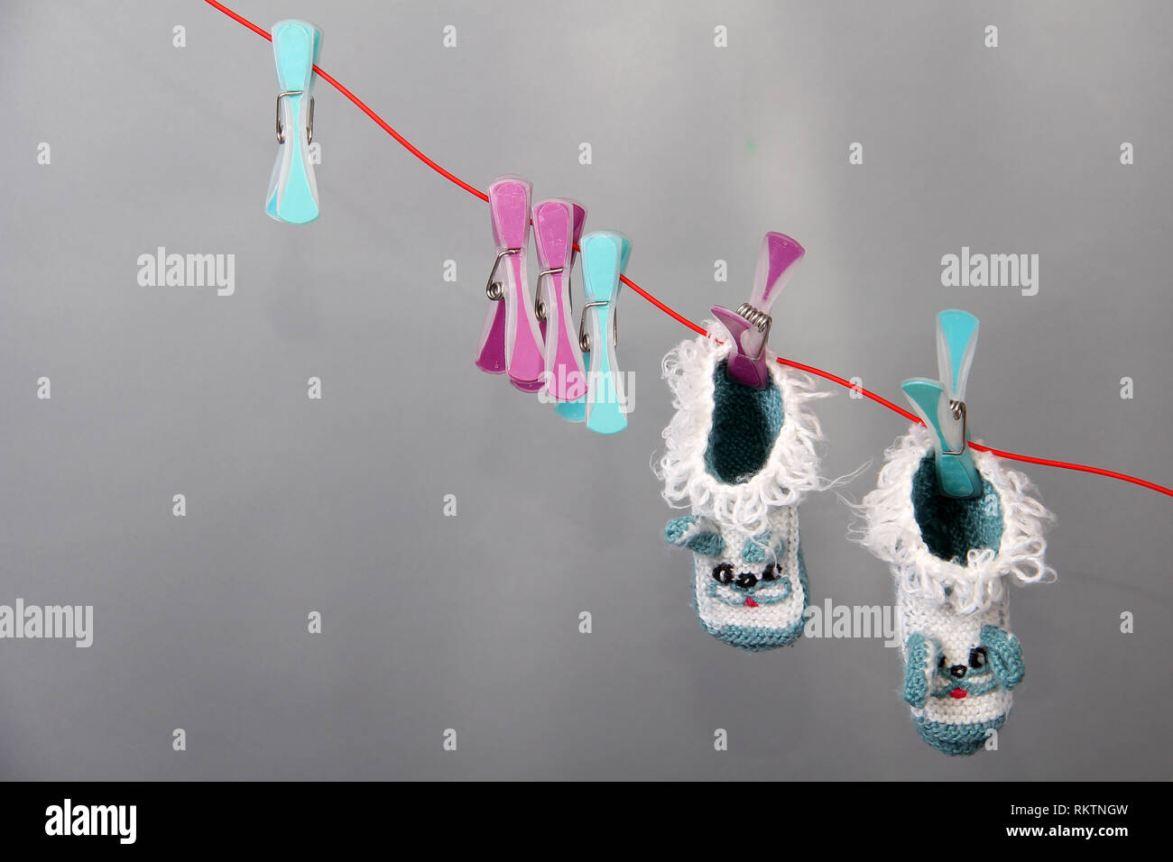 Childhood / Various children's clothing hanging on clothesline Stock