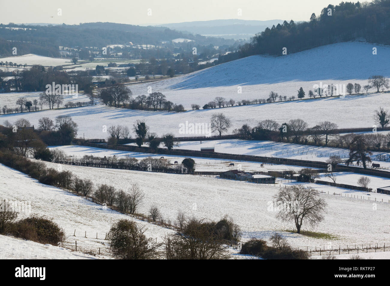 Winter view of the Hambleden Valley with snow on the ground. Stock Photo