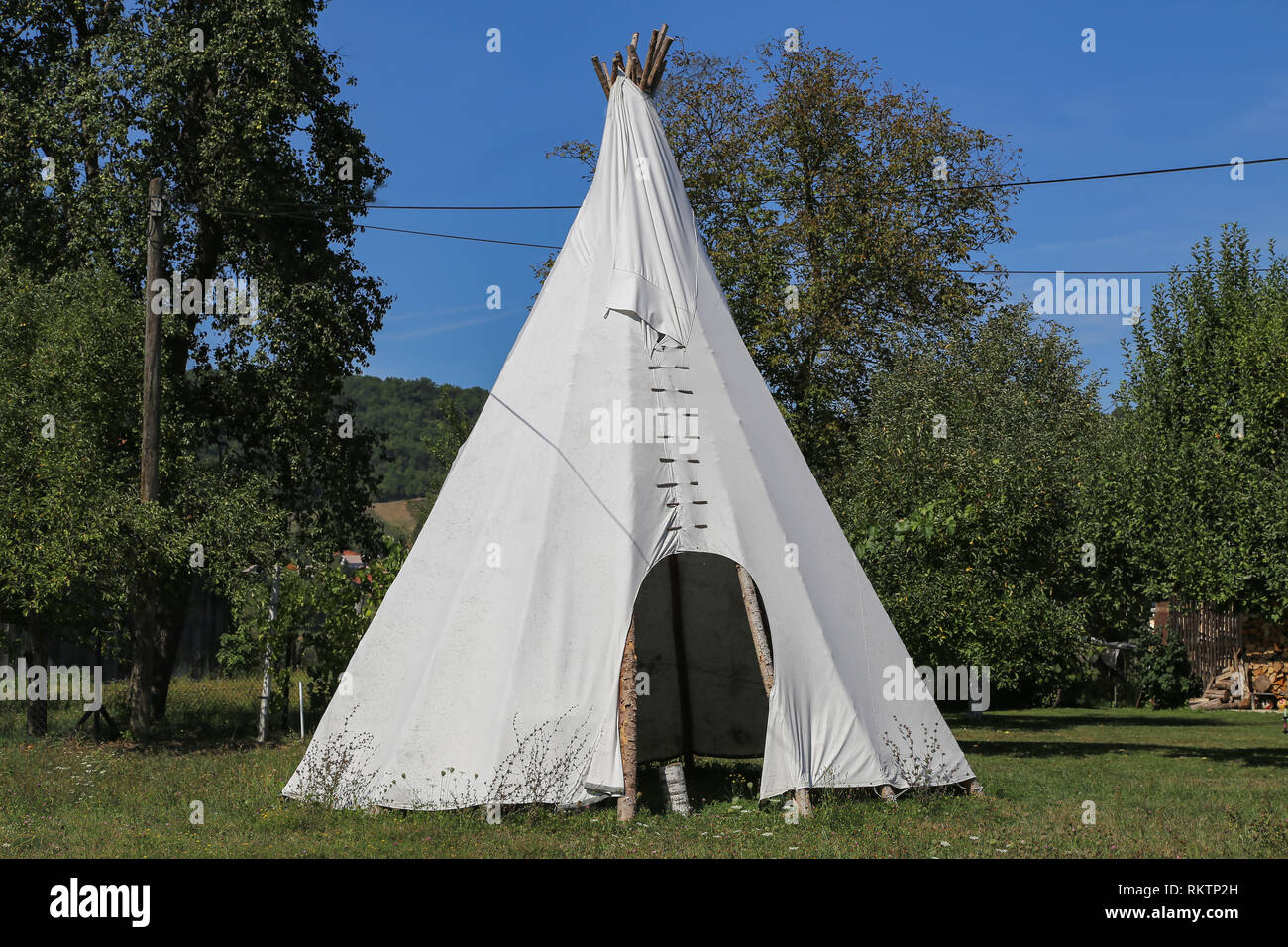 Wigwam in American style pitched in the field Stock Photo - Alamy
