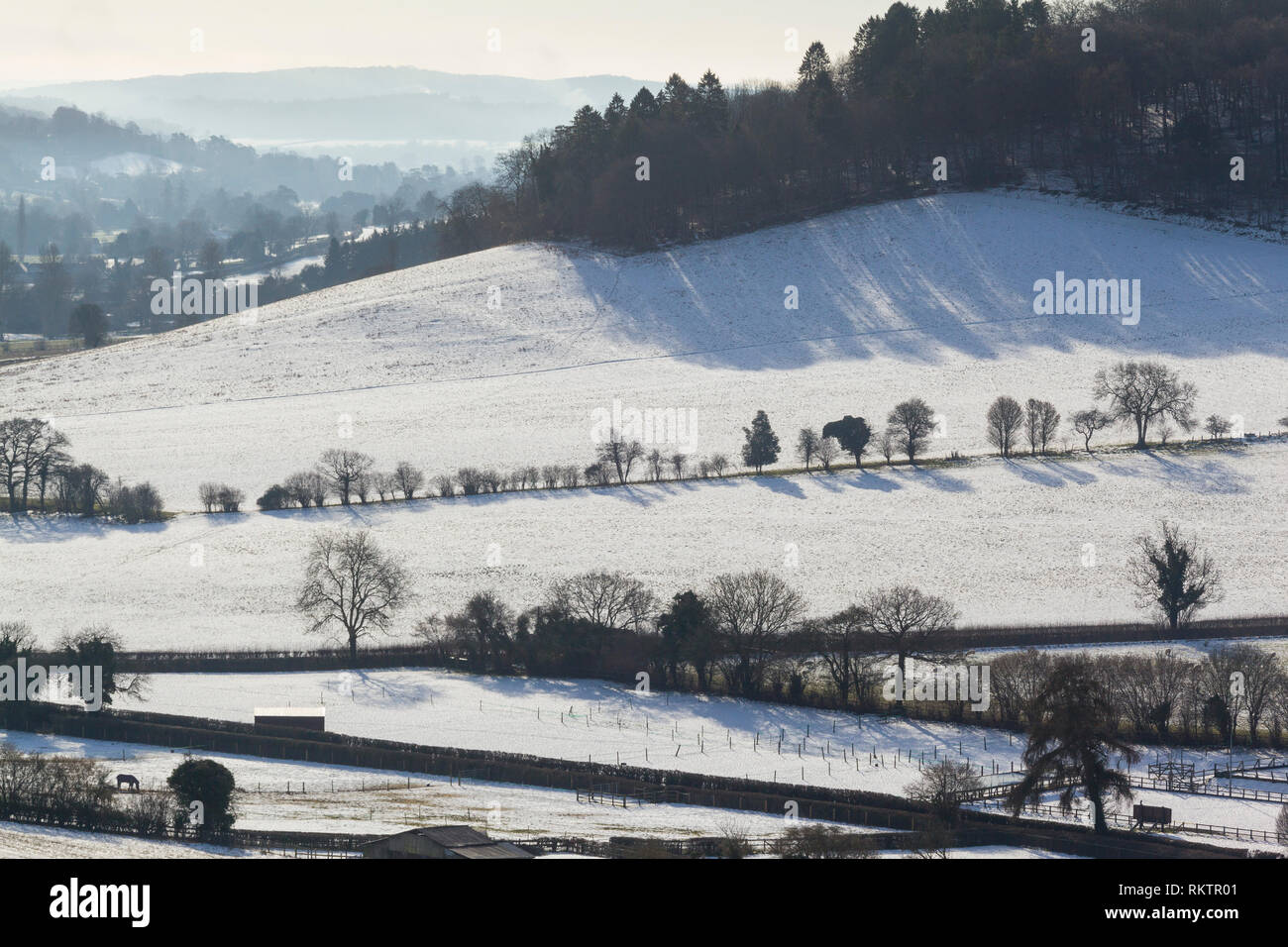 Winter view of the Hambleden Valley with snow on the ground. Stock Photo