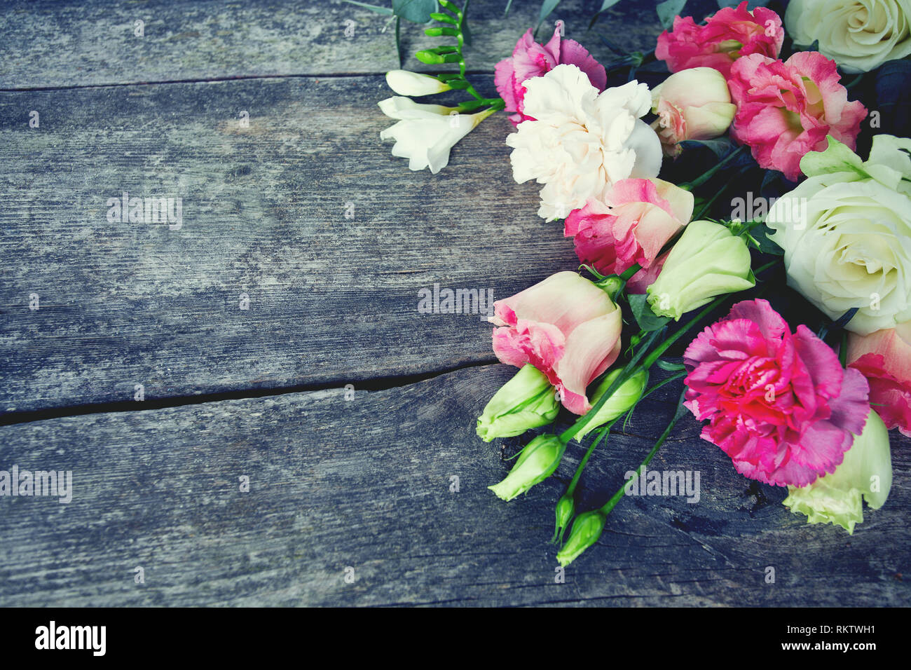 bouquet of beautiful flowers on wooden surface Stock Photo