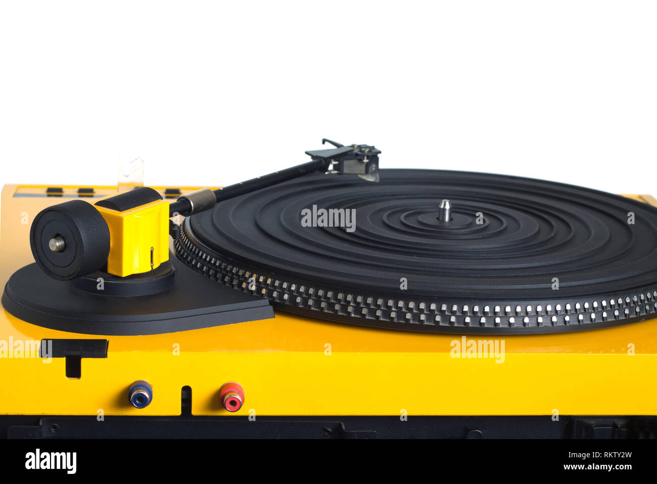 Turntable with black tonearm in yellow case with rubber mat on disc with stroboscope marks with output connectors rear view isolated on white backgrou Stock Photo