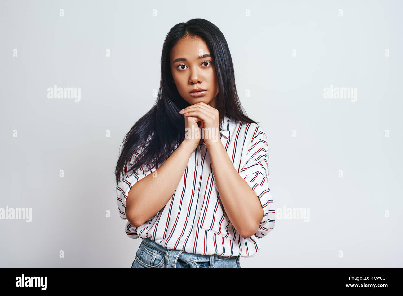 Just Calm Studio Shot Of Charming Young Asian Female With Natural