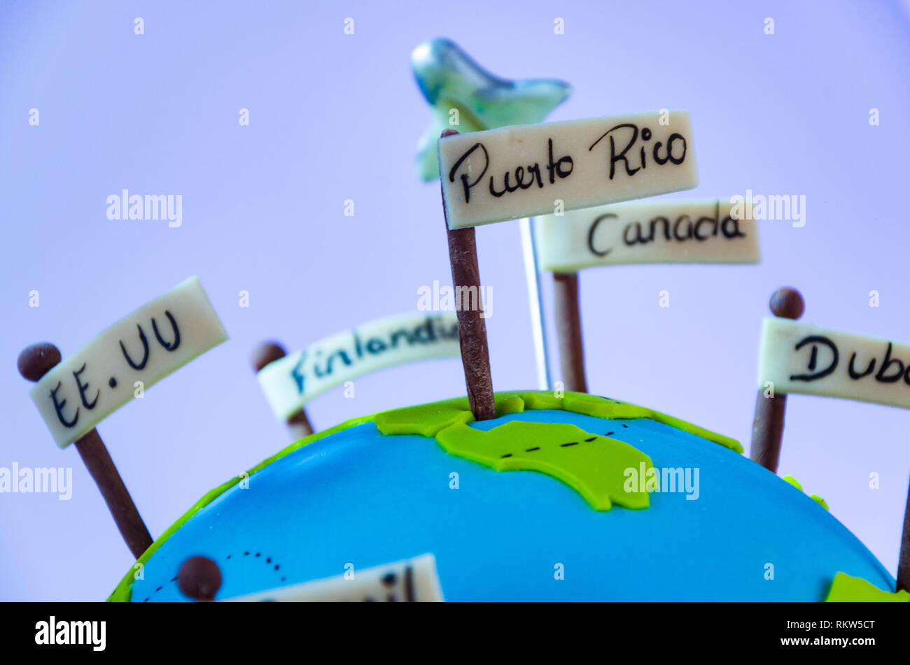 Miniature world with pennants of different countries and small plane, Travel Concept. Stock Photo