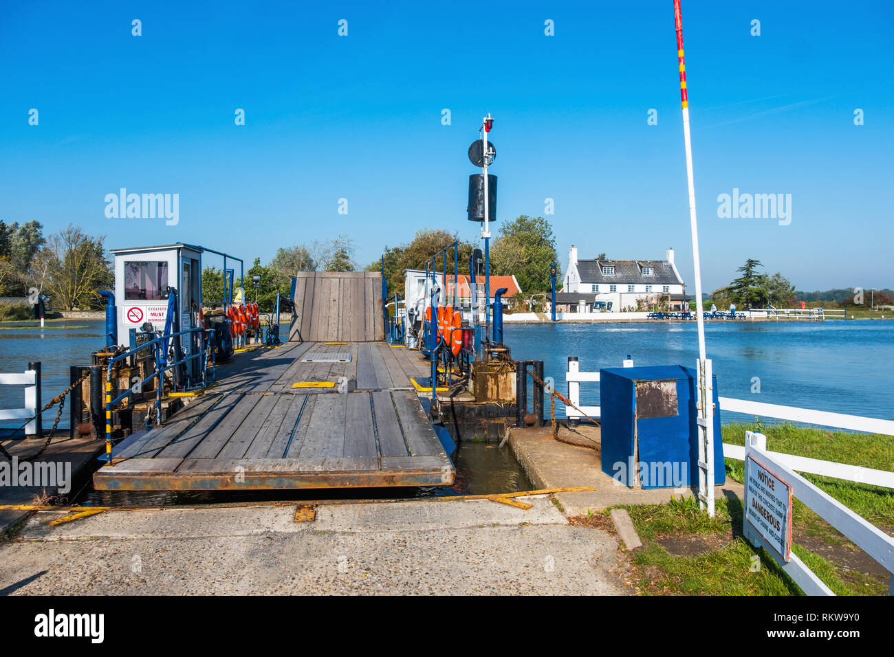 Reedham ferry over the River Yare in Norfolk with a strong tidal flow running. Stock Photo