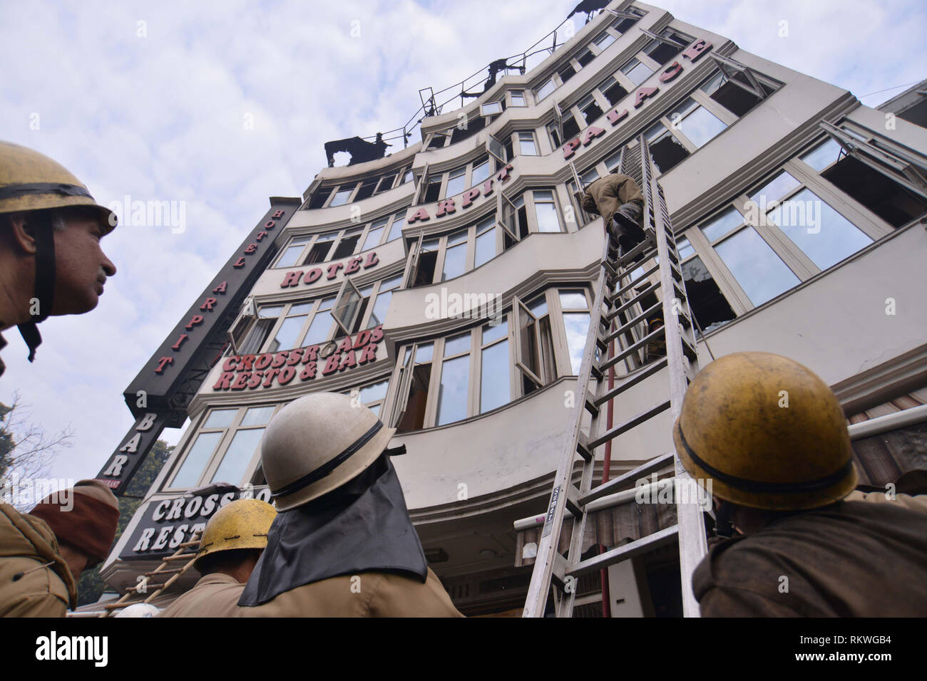 New Delhi, India. 12th Feb, 2019. Rescuers search for survivors at Arpit Palace Hotel in Delhi's Karol Bagh area, India, Feb. 12, 2019. The massive fire that broke out inside the four-storey hotel claimed as many as 17 innocent lives, including one child and three women, early on Tuesday, official sources confirmed. Credit: Partha Sarkar/Xinhua/Alamy Live News Stock Photo