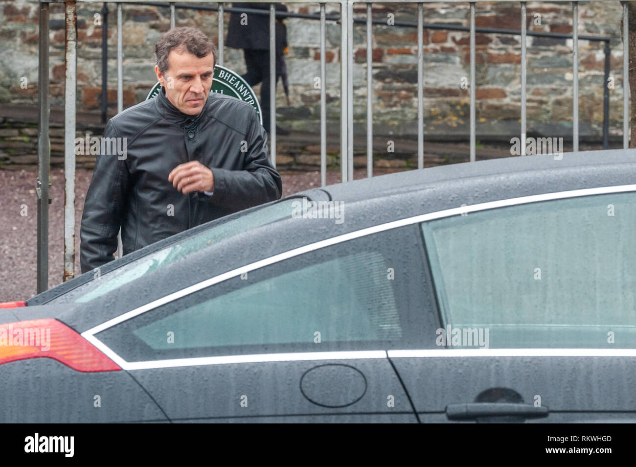 Bantry, West Cork, Ireland. 12th Feb, 2019. The funeral of French artist and writer Tomi Ungerer was held at the Church of St. Brendan the Navigator in Bantry today.  Mr Stéphane Crouzat, Ambassador of France to Ireland who spoke at the funeral with a message from President Macron, is pictured leaving the church. Mr Ungerer's remains are to be cremated tomorrow in a private ceremony. Credit: Andy Gibson/Alamy Live News. Stock Photo