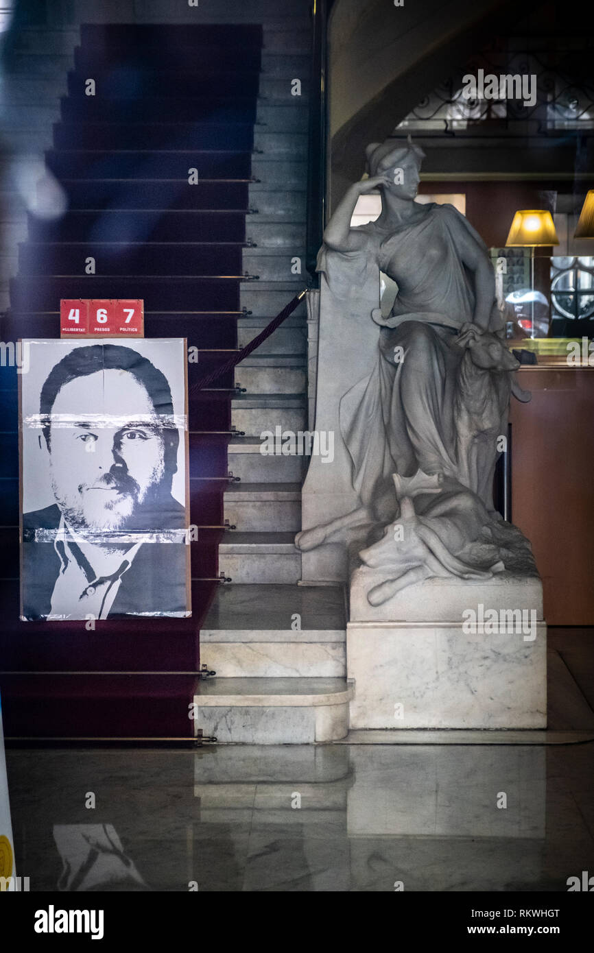 Barcelona, Spain. 12th Feb 2019. A portrait of Oriol Junqueras, former head of the Department of Economy and Finance, is seen on the main stairs of the Department with a count of days he has been in prison. Hundreds of workers and officials of the General office of Catalonia have gone out to show their solidarity with political prisoners on their first day of trial.  The workers of the Department of Economy have blocked the traffic of the Gran Vía during the protest. Credit: SOPA Images Limited/Alamy Live News Stock Photo