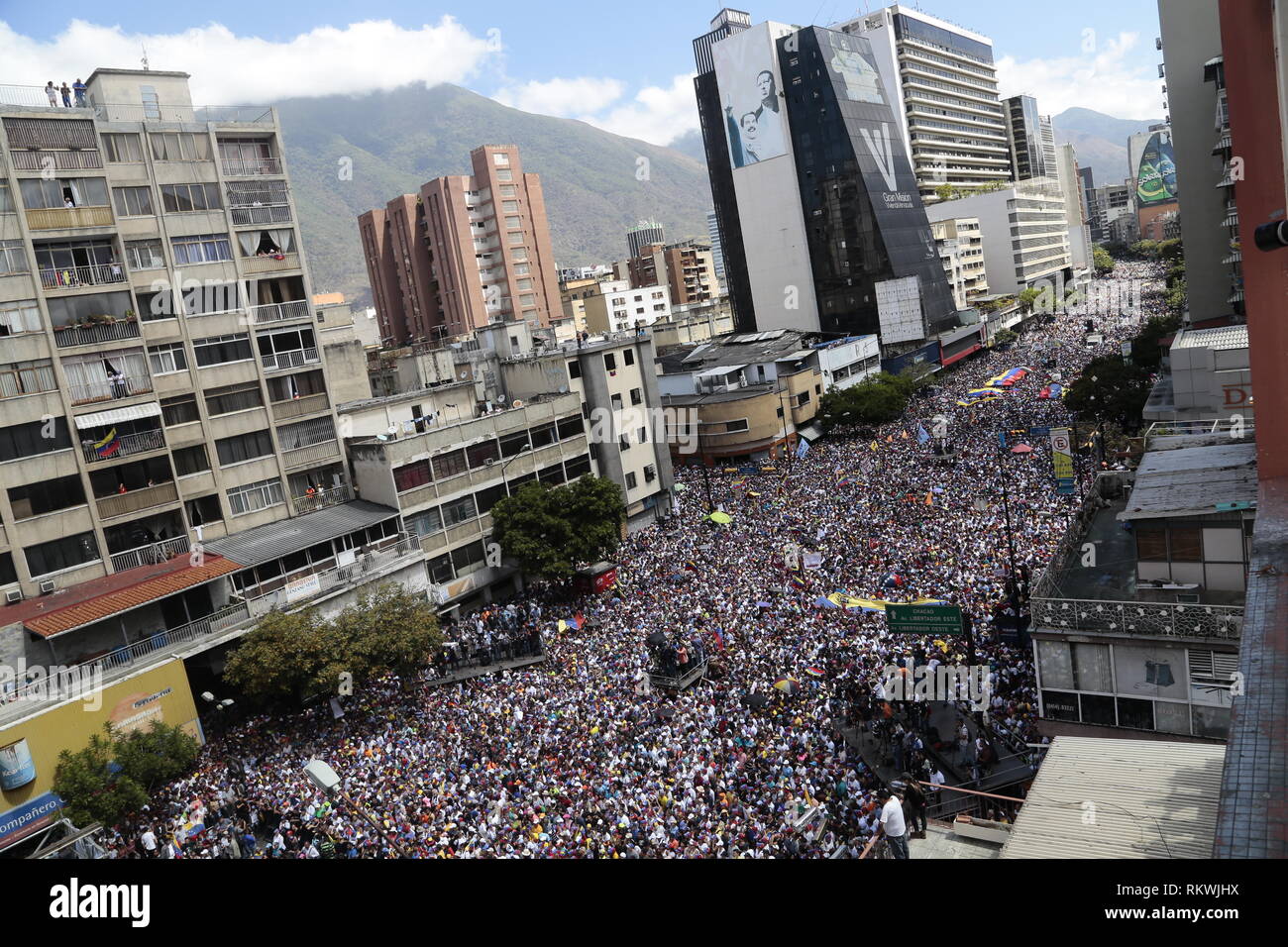 Caracas, Venezuela. 12th Feb, 2019. Numerous people protest in the Venezuelan capital against the government of President Maduro. On the occasion of Youth Day, government opponents called on the armed forces to allow humanitarian aid for the suffering population into the country. Since last week, ten trucks with about 100 tons of relief supplies have been waiting in the Colombian border town of Cúcuta for permission to pass. Credit: Rafael Hernandez/dpa/Alamy Live News Stock Photo