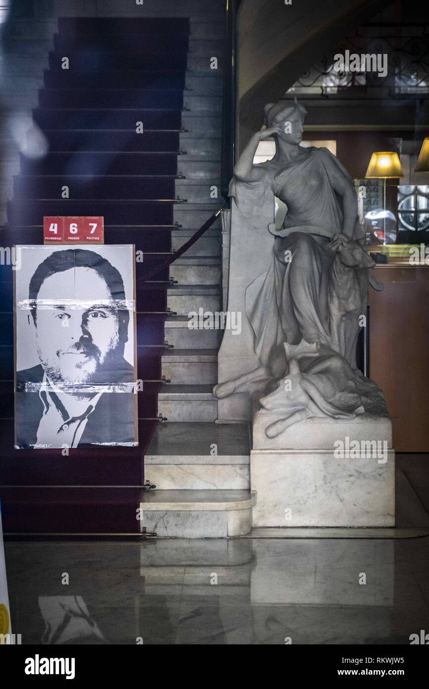 Barcelona, Catalonia, Spain. 12th Feb, 2019. A portrait of Oriol Junqueras, former head of the Department of Economy and Finance, is seen on the main stairs of the Department with a count of days he has been in prison.Hundreds of workers and officials of the General office of Catalonia have gone out to show their solidarity with political prisoners on their first day of trial. The workers of the Department of Economy have blocked the traffic of the Gran VÃ-a during the protest. Credit: Paco Freire/SOPA Images/ZUMA Wire/Alamy Live News Stock Photo