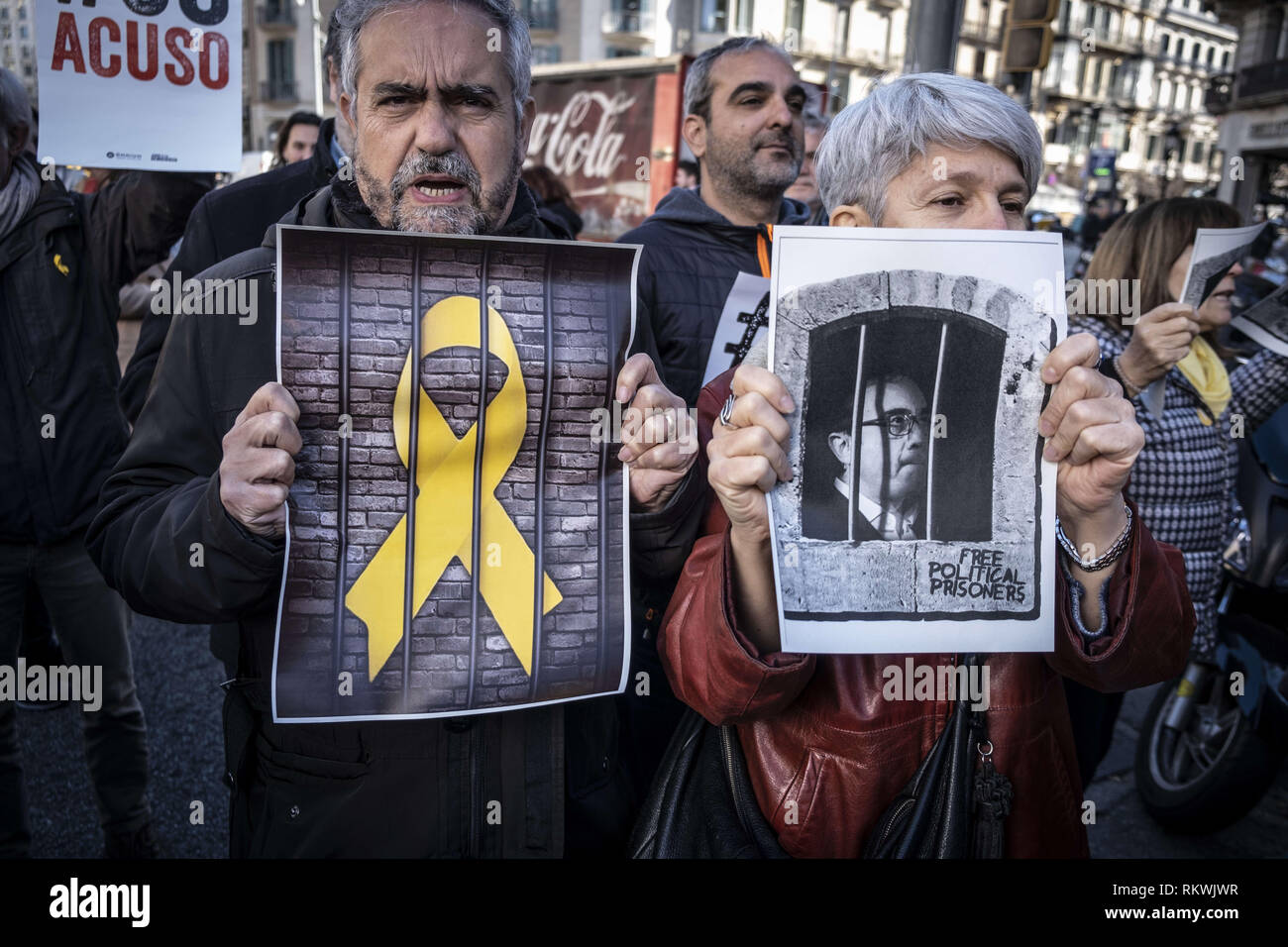 Barcelona, Catalonia, Spain. 12th Feb, 2019. Workers of the Department of Economy and Finance show solidarity posters with political prisoners.Hundreds of workers and officials of the General office of Catalonia have gone out to show their solidarity with political prisoners on their first day of trial. The workers of the Department of Economy have blocked the traffic of the Gran VÃ-a during the protest. Credit: Paco Freire/SOPA Images/ZUMA Wire/Alamy Live News Stock Photo