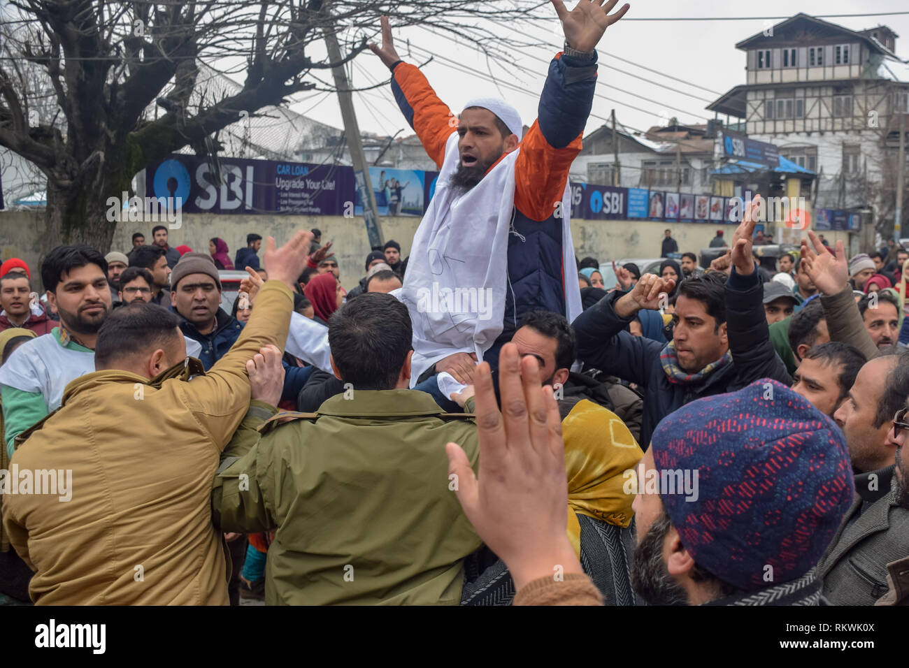February 12, 2019 - Srinagar, Jammu & Kashmir, India - A NHM Protester seen shouting anti government slogans during the protest in Srinagar..NHM (National Health Mission) employees on took out an anti-government protest march towards the Raj Bhavan in Srinagar. The employees who have been on a strike since the past thirty days are demanding regularization in a phased manner, equal pay for equal work and other social security benefits. Police used batons on the Protesters and many of them were detained during the protest. (Credit Image: © Idrees Abbas/SOPA Images via ZUMA Wire) Stock Photo