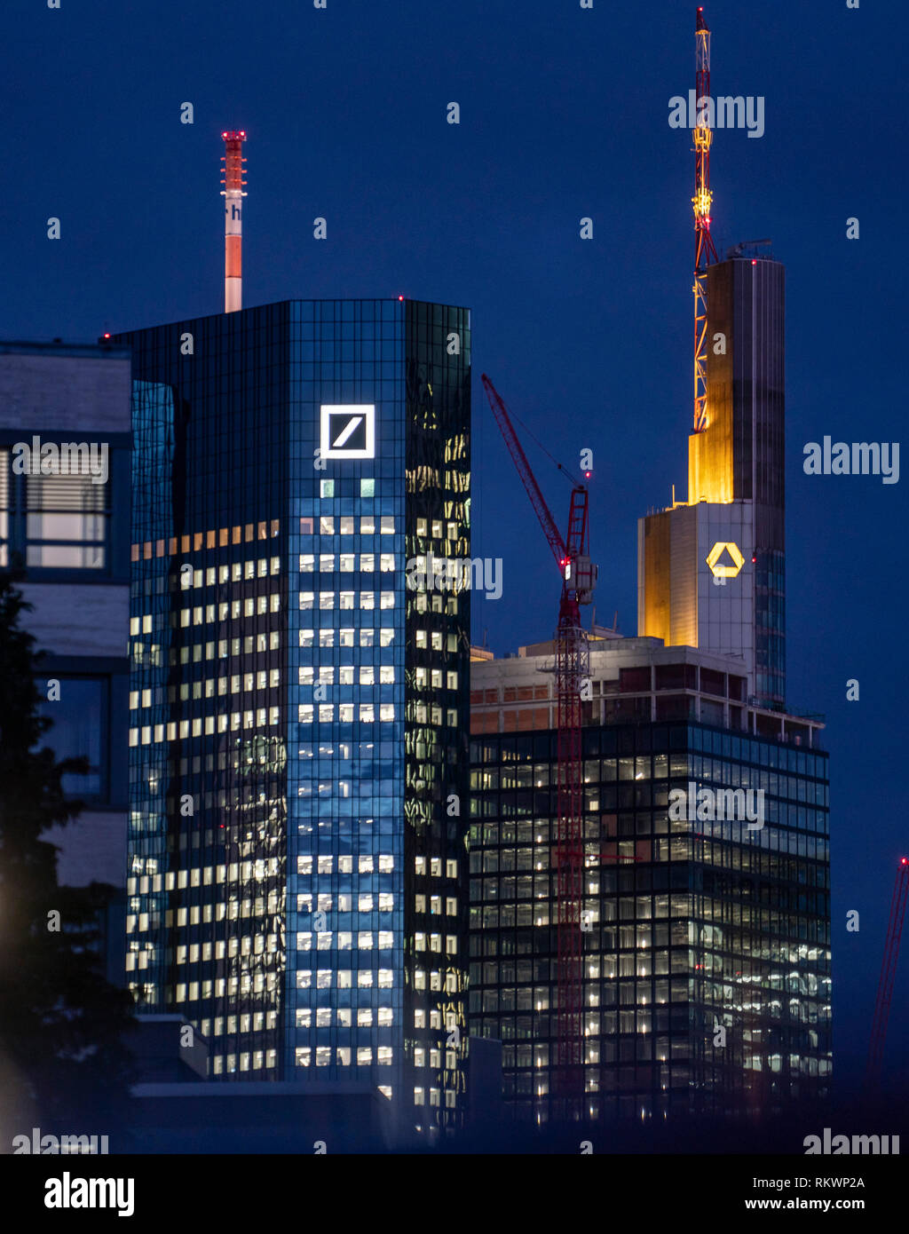 12 February 2019, Hessen, Frankfurt/Main: The head offices of Deutsche Bank (l) and Commerzbank are merged by the telephoto lens. Speculations about a possible merger of the two banks have not yet been confirmed. Photo: Frank Rumpenhorst/dpa Stock Photo