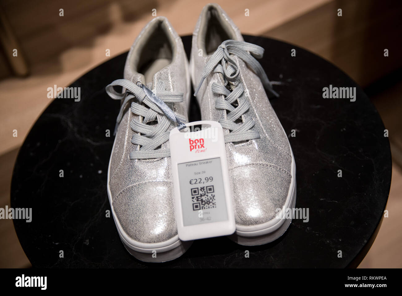 Hamburg, Germany. 04th Feb, 2019. Silver shoes stand on a table in the new  Bonprix Pilot shop in downtown Hamburg. Under the motto "fashion connect",  Bonprix, an Otto Group company, wants to