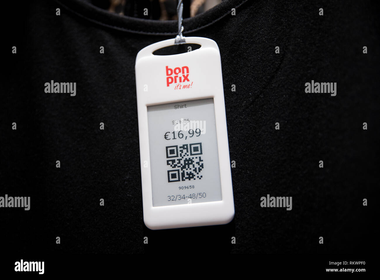 Hamburg, Germany. 04th 2019. A price tag QR code hangs on a black T-shirt in the new Bonprix Pilot store in downtown Hamburg. Under the motto "fashion connect", Bonprix, an