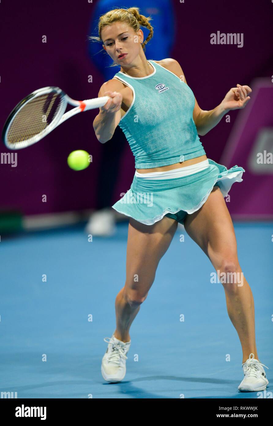 Doha, Qatar. 12th Feb, 2019. Camila Giorgi of Italy returns the ball during the women's singles first round match between Kiki Bertens of the Netherlands and Camila Giorgi of Italy at the 2019 WTA Qatar Open in Doha, Qatar, on Feb. 12, 2019. Camila Giorgi lost 1-2. Credit: Nikku/Xinhua/Alamy Live News Stock Photo