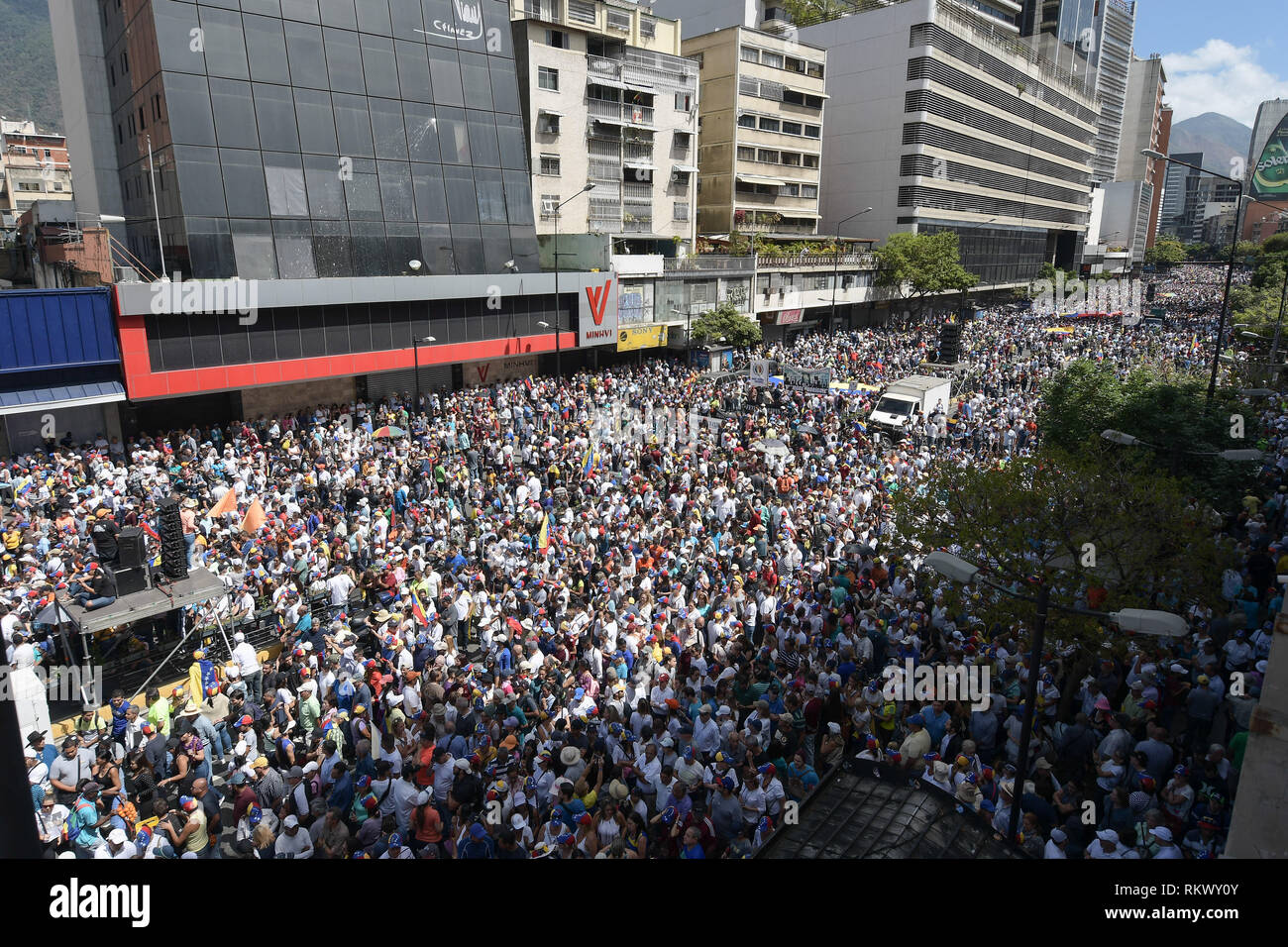 Caracas, Miranda, Venezuela. 12th Feb, 2019. A general view of the crowd during a protest to call for a change in the government.Opponents gather at a protest organised by the PSUV (United Socialist Party of Venezuela) after the call from interim president Juan Guaido, to show their support to him, while asking the army to allow more humanitarian aids into the country. Credit: Roman Camacho/SOPA Images/ZUMA Wire/Alamy Live News Stock Photo