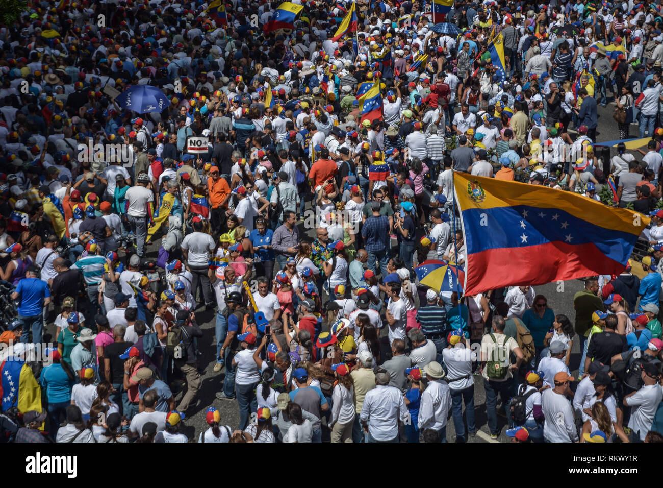 Caracas, Miranda, Venezuela. 12th Feb, 2019. A general view of the crowd during a protest to call for a change in the government.Opponents gather at a protest organised by the PSUV (United Socialist Party of Venezuela) after the call from interim president Juan Guaido, to show their support to him, while asking the army to allow more humanitarian aids into the country. Credit: Roman Camacho/SOPA Images/ZUMA Wire/Alamy Live News Stock Photo