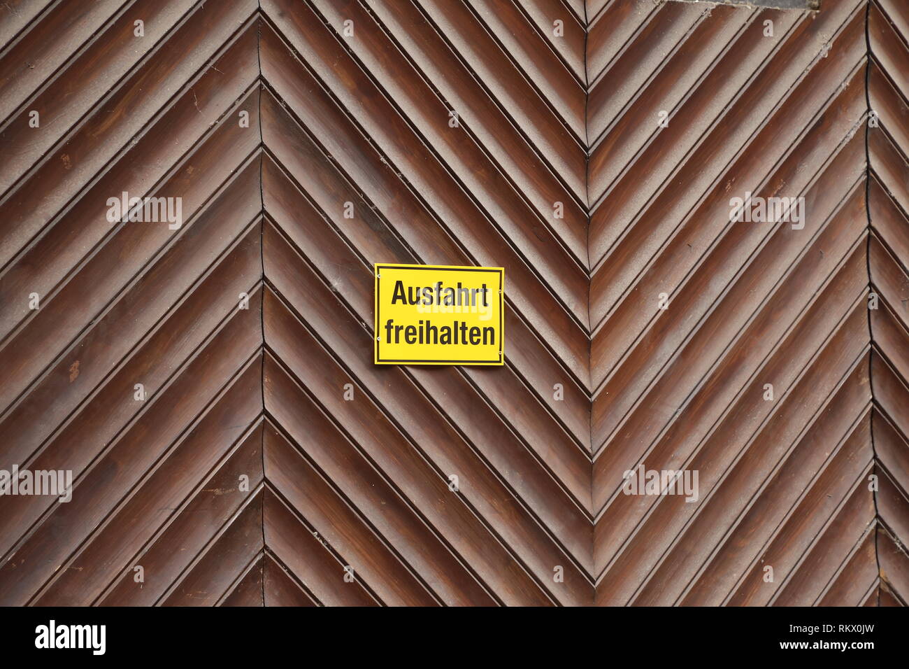 Gate / Inscription on the gate in German keep the exit clear Stock