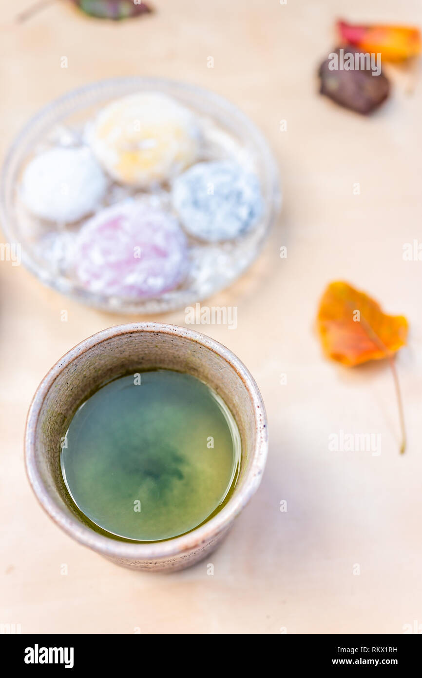 Green tea cup and mochi rice cake Japanese dessert wagashi colorful