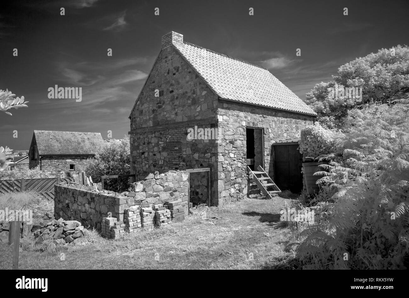 An infrared monochrome image of the Old Watermill on Alderney, Channel Islands. Stock Photo