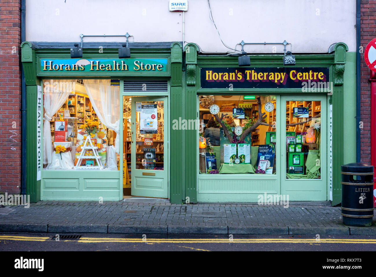 Health store shop front windows. Horans Health Store, Killarney, County Kerry, Ireland. Health supplements VAT increase in Ireland concept. Stock Photo