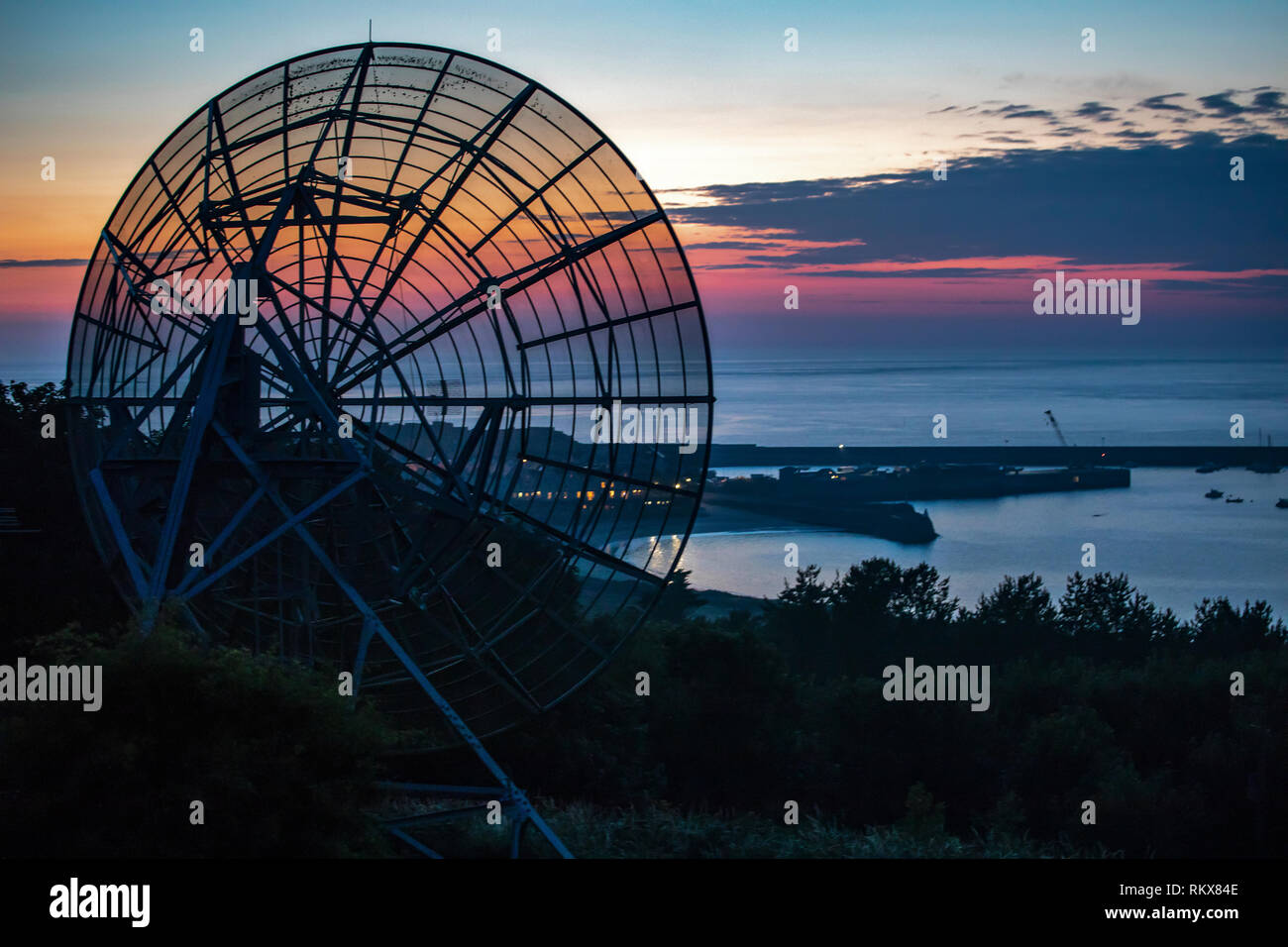 A communications dish at Valongis, on Alderney, Channel Islands. Stock Photo