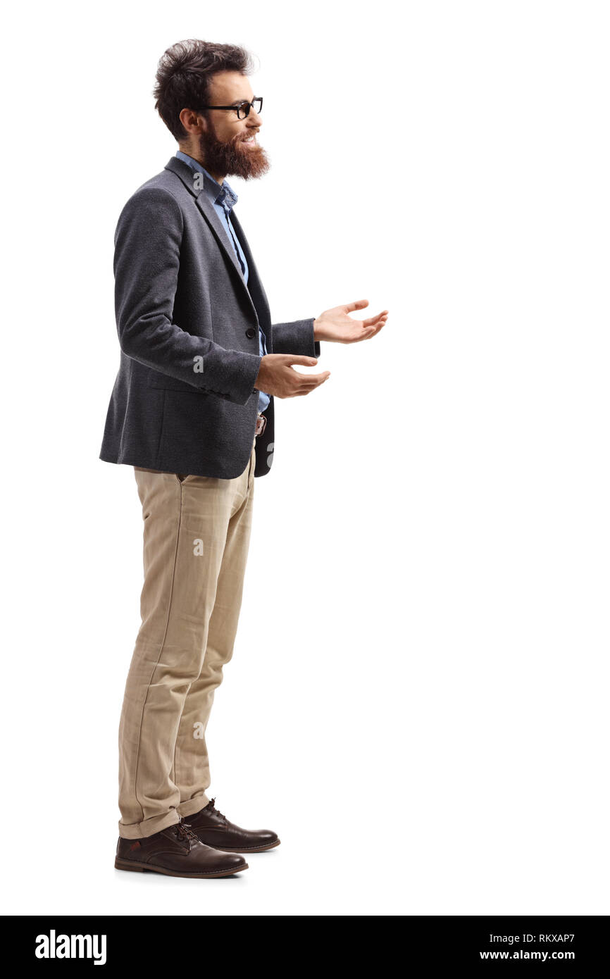 Full length profile shot of a man standing and explaining with hands isolated on white background Stock Photo