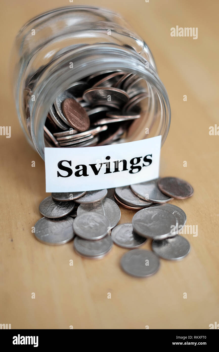 Money jar for savings and investment IRA 401k retirement or college rainy day Stock Photo