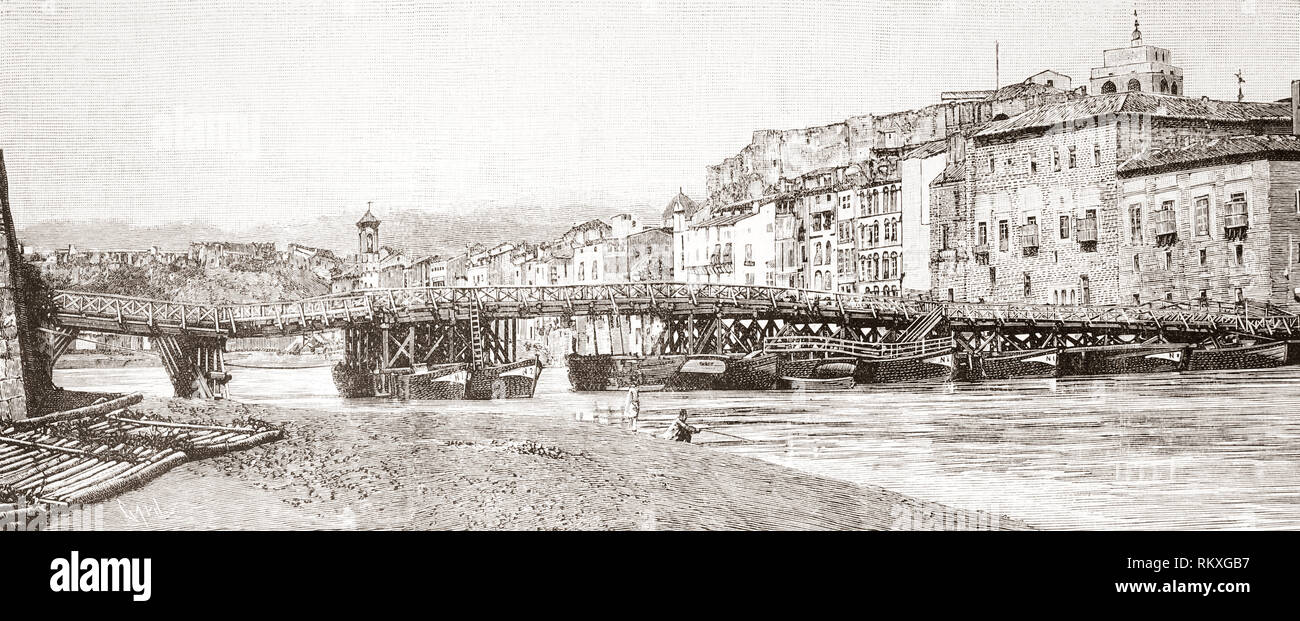 The age-old bridge over the River Ebro, Tortosa, Spain seen here before being burnt in 1892.  From La Ilustracion Espanola y Americana, published 1892. Stock Photo