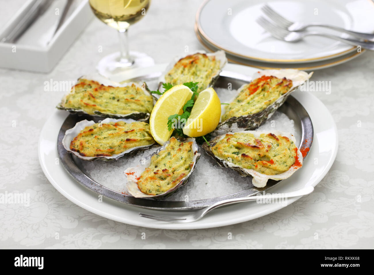 oysters rockefeller, baked oysters on half shell topped with green