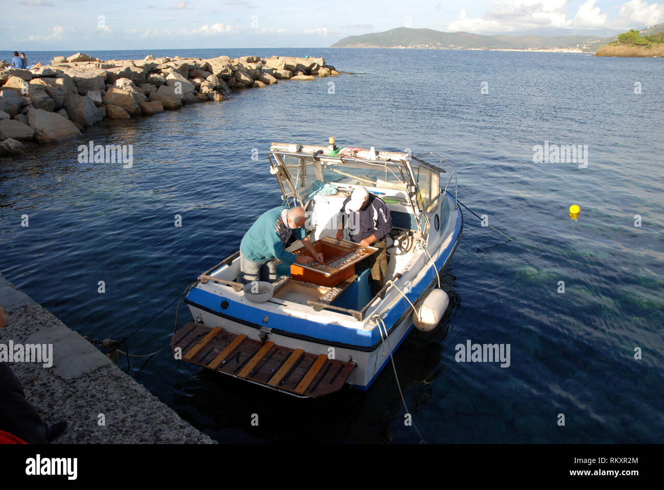before leaving from the port on the boat fishermen prepare a longline ...