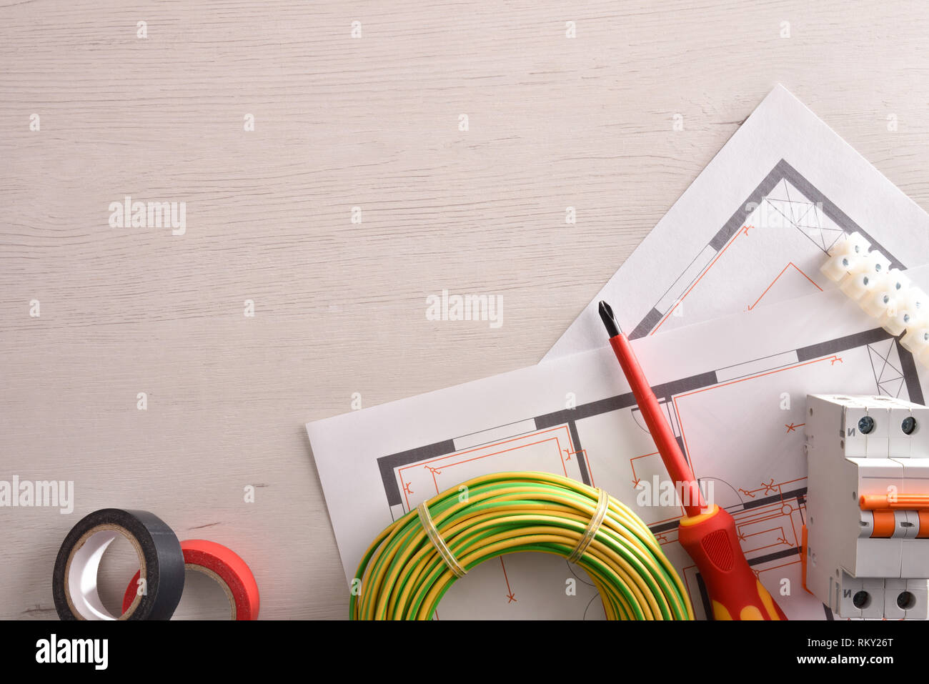 Equipment on white wooden table for electrical installation of housing ...