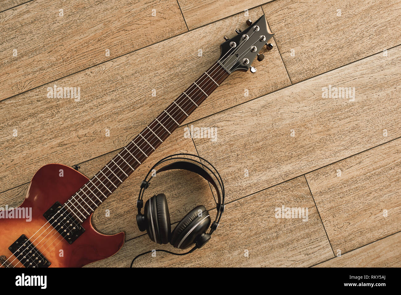Guitar recording. An electric guitar and professional headphones on a