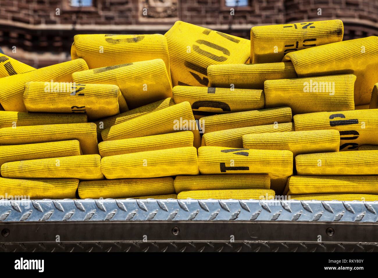 Folded yellow fire hoses Stock Photo Alamy