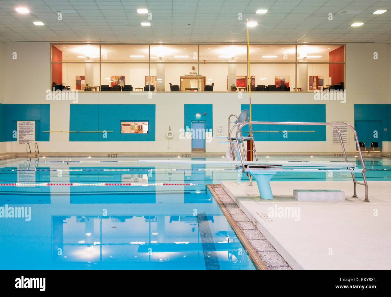 Indoor swimming pool with diving board hires stock photography and