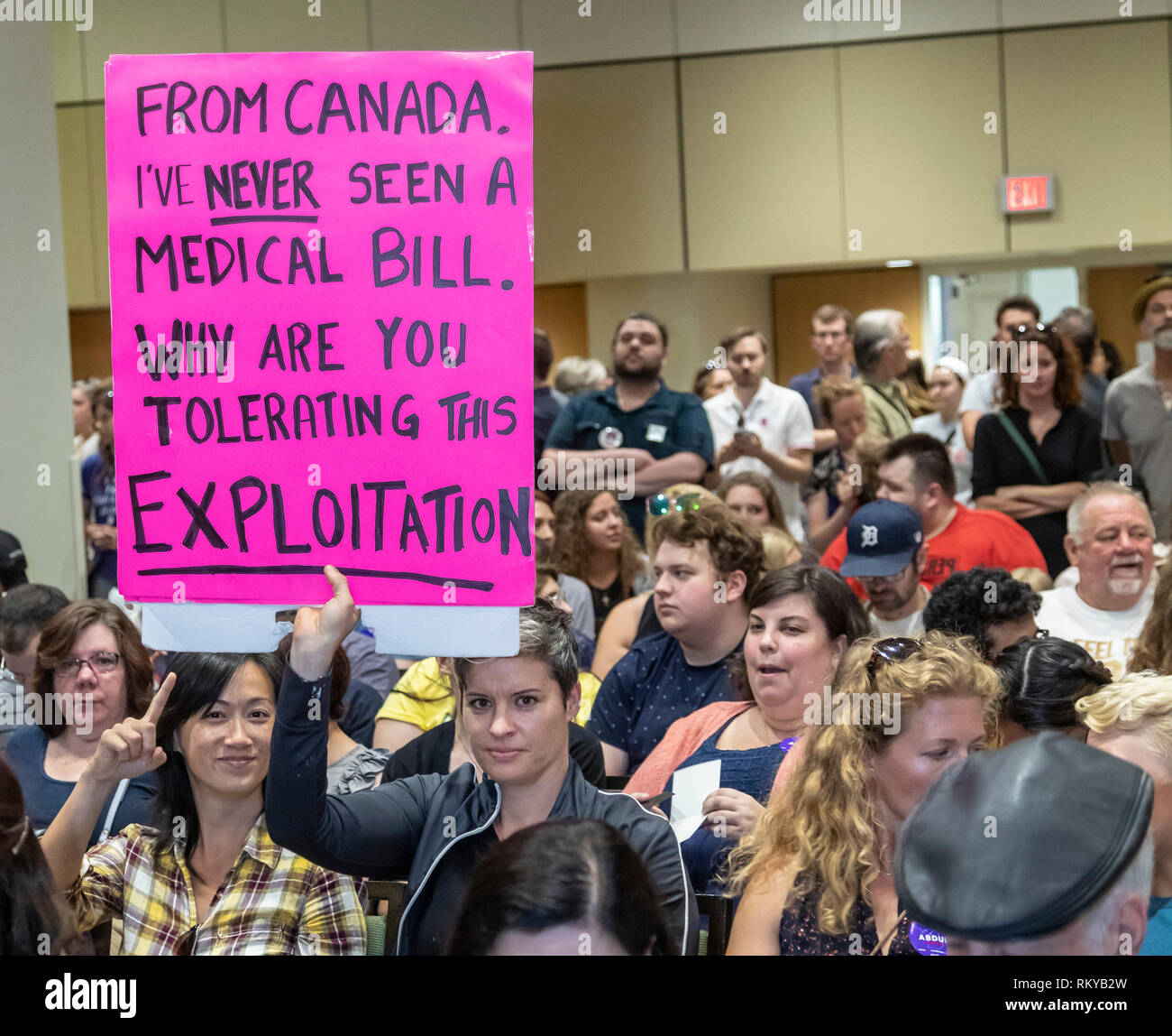 Detroit, Michigan - A Canadian woman holds a sign about the virtues of Canada's single payer health care system during a rally at Wayne State Universi Stock Photo