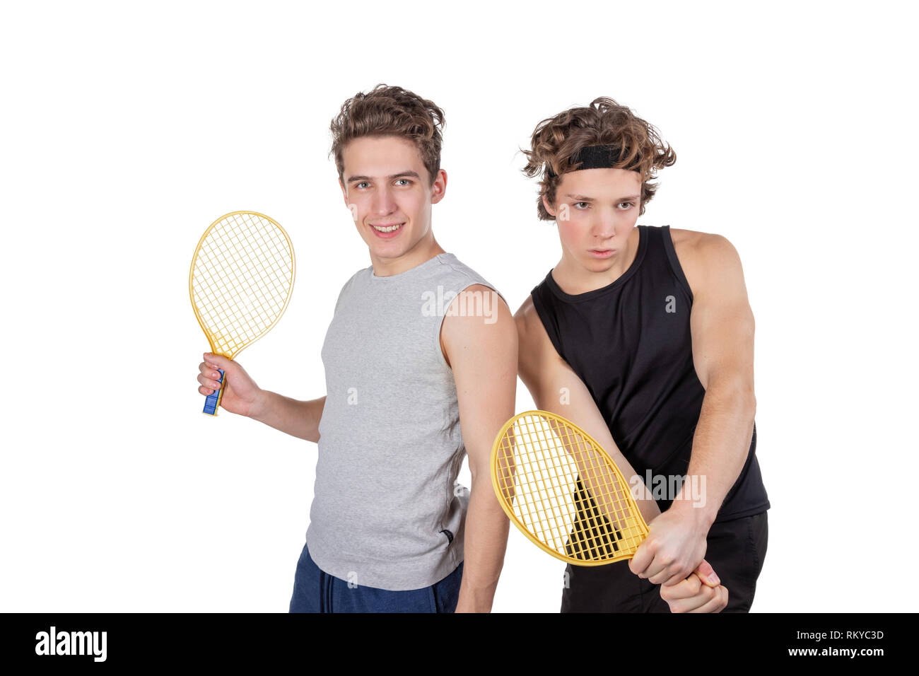 Two handsome guys play tennis isolated Stock Photo - Alamy