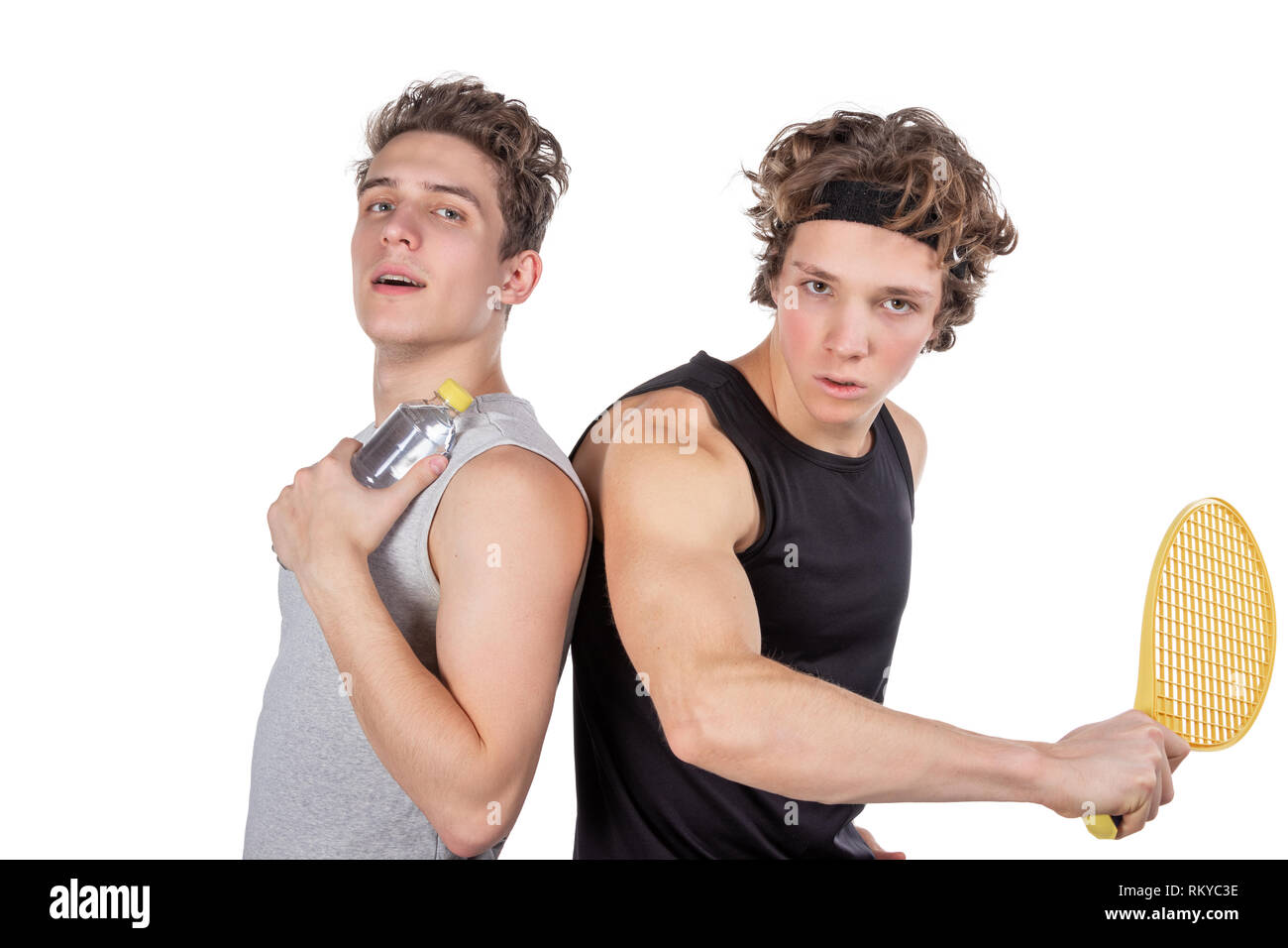 Two handsome guys play tennis isolated Stock Photo - Alamy