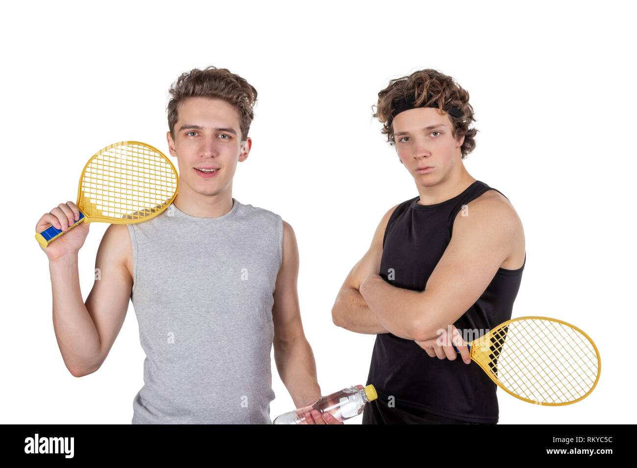 Two handsome guys play tennis isolated Stock Photo - Alamy