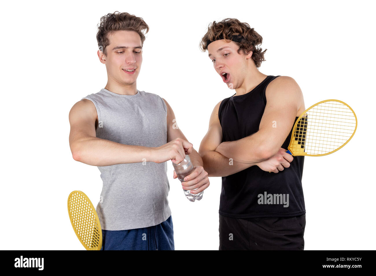Two handsome guys play tennis isolated Stock Photo - Alamy