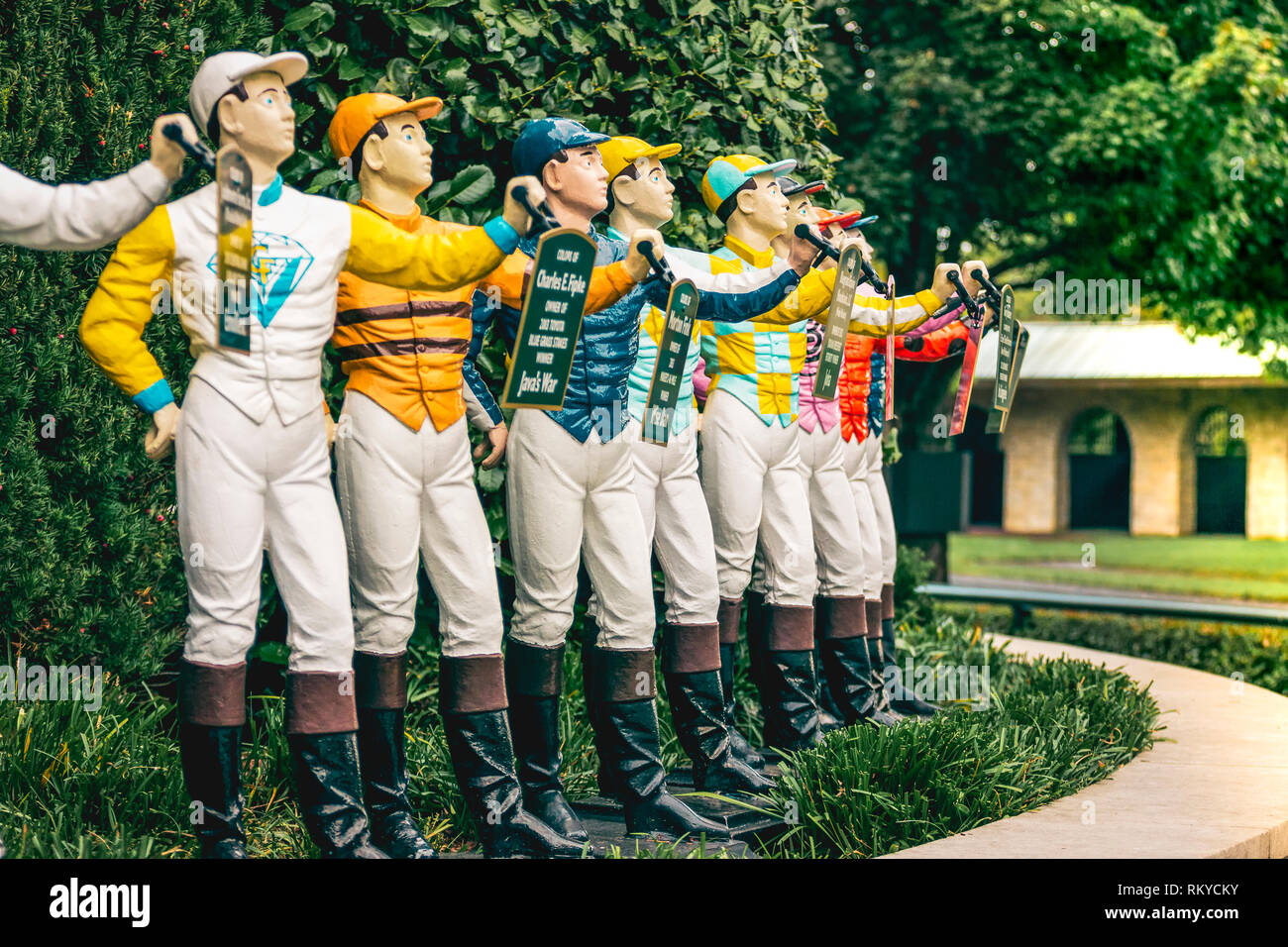 Jockey statues painted in the winning colors seen in the paddock of