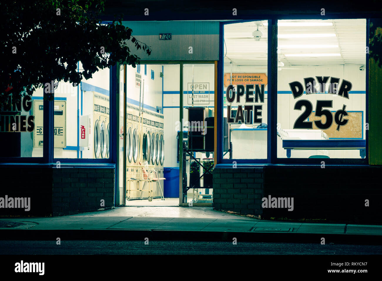 Night view of a laundromat facade in Ramona in California Stock Photo