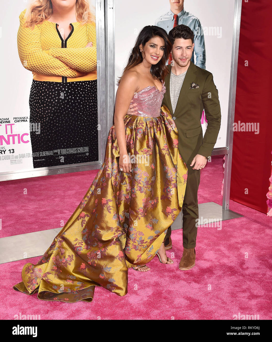 LOS ANGELES, CA - FEBRUARY 11: Priyanka Chopra (L) and Nick Jonas arrive at the Premiere Of Warner Bros. Pictures' 'Isn't It Romantic' at The Theatre  Stock Photo
